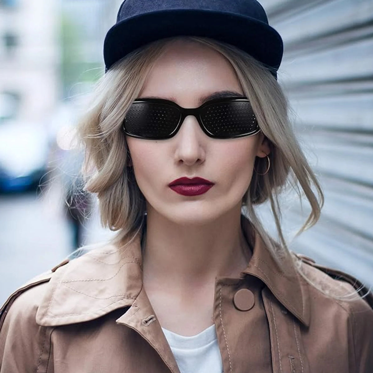 A young woman wearing HopeLens pinhole glasses Sport model.